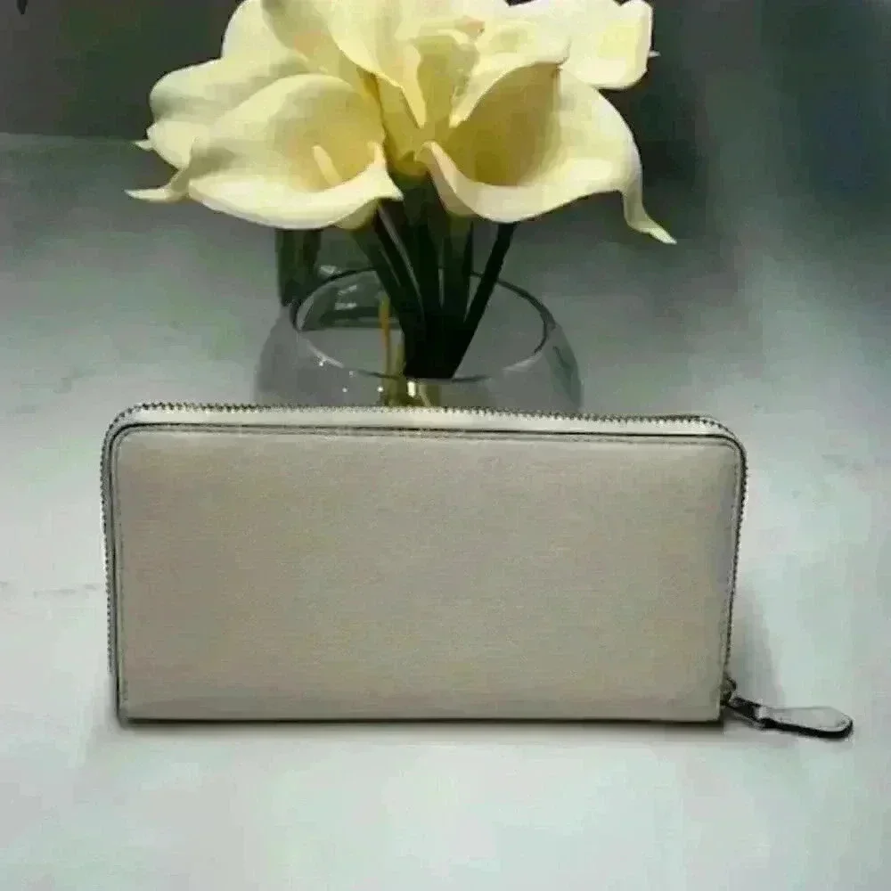 Coach Pebbled Leather Turnlock Bow Accordian Zip Wallet Cream 53415